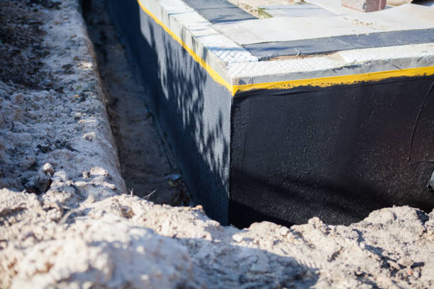 Professional Basement Waterproofing technician working in Mayville, MI